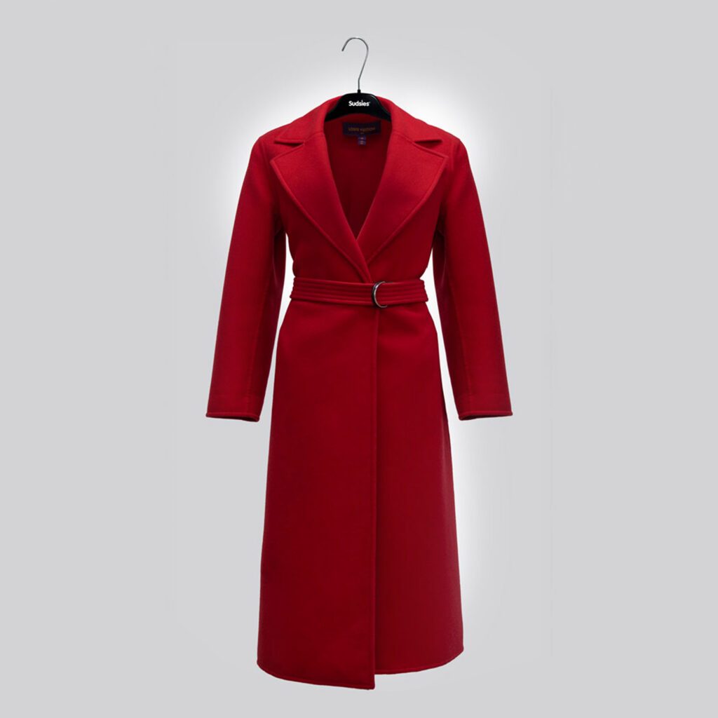 Red wool coat professionally cleaned and presented by Sudsies Dry Cleaning
