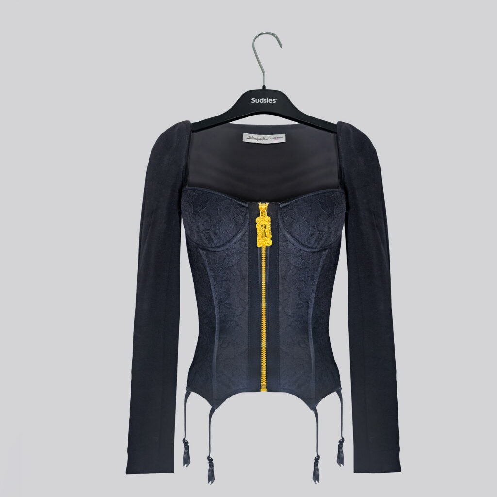 Luxury corset-style garment on a Sudsies hanger prepared for professional garment care